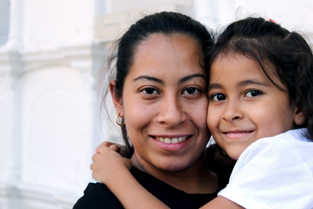 Family with children smiling outside a dental clinic in Scarborough